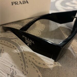 Prada Black Sunglasses with Elegant White Case